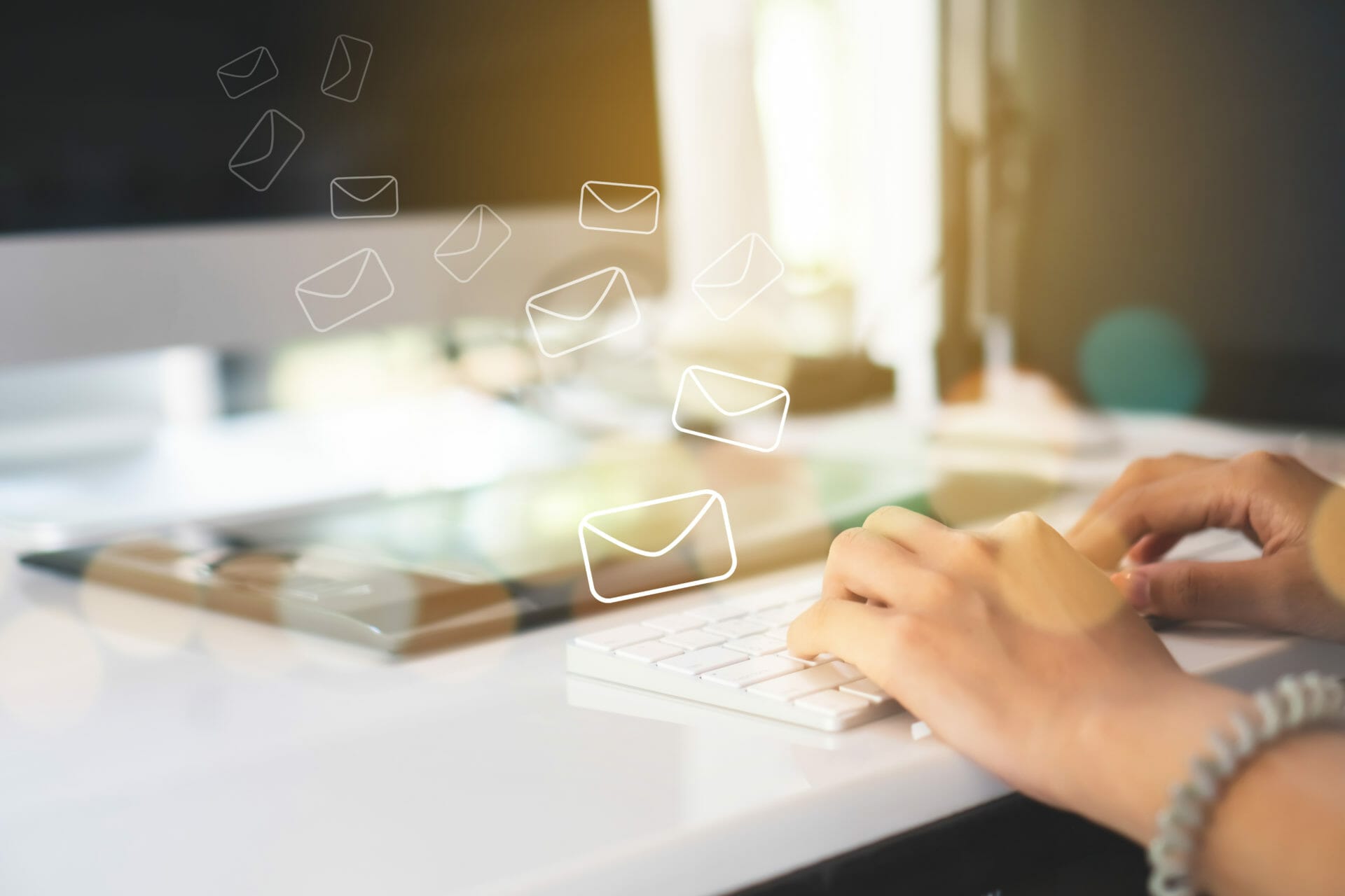 Woman hand using smartphone to send and recieve email for business on bokeh vintage color tone background.