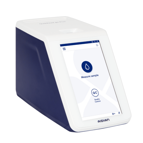 Aidian QuikRead go Plus Instrument, a compact automatic medical device with a touchscreen for sample analysis and quality control.